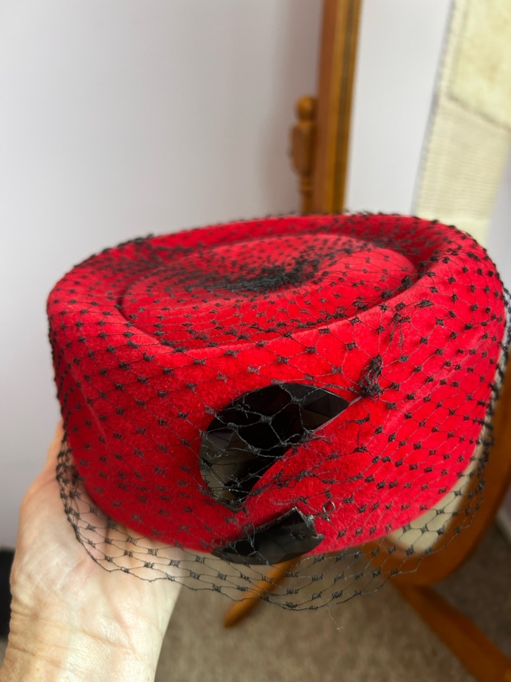 Red Veiled Pillbox Hat with Decorative Accent